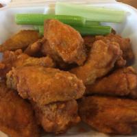 Kickin' Chicken Wings · Cooked wings of a chicken coated in sauce or seasoning. 