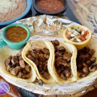 Tacos From the Grill · 4 corn or flour tortillas served with pico de gallo, tomatillo hot sauce and either beans or...