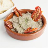 Olive Tapenade with sundried tomato · Sun-dried tomatoes and tapenade. Served with bread. 100% vegan, organic, GF and SF