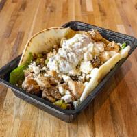The Hercules Pita Bowl · Chicken and gyro cooked in our secret sauce! With a choice of greens, grilled mushrooms, gri...