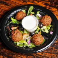 4 Pieces Falafel · Round patties of ground garbanzos mixed with finely chopped onions, garlic, parsley, cilantr...
