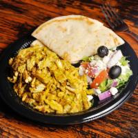 Chicken Shawarma Plate · Layers of marinated chicken cooked on a rotisserie, rice and salad. Served with pita bread a...