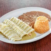 Suizas Enchilada · 3 chicken enchiladas topped with creamy green tomatillo sauce, grated cheese and sour cream....