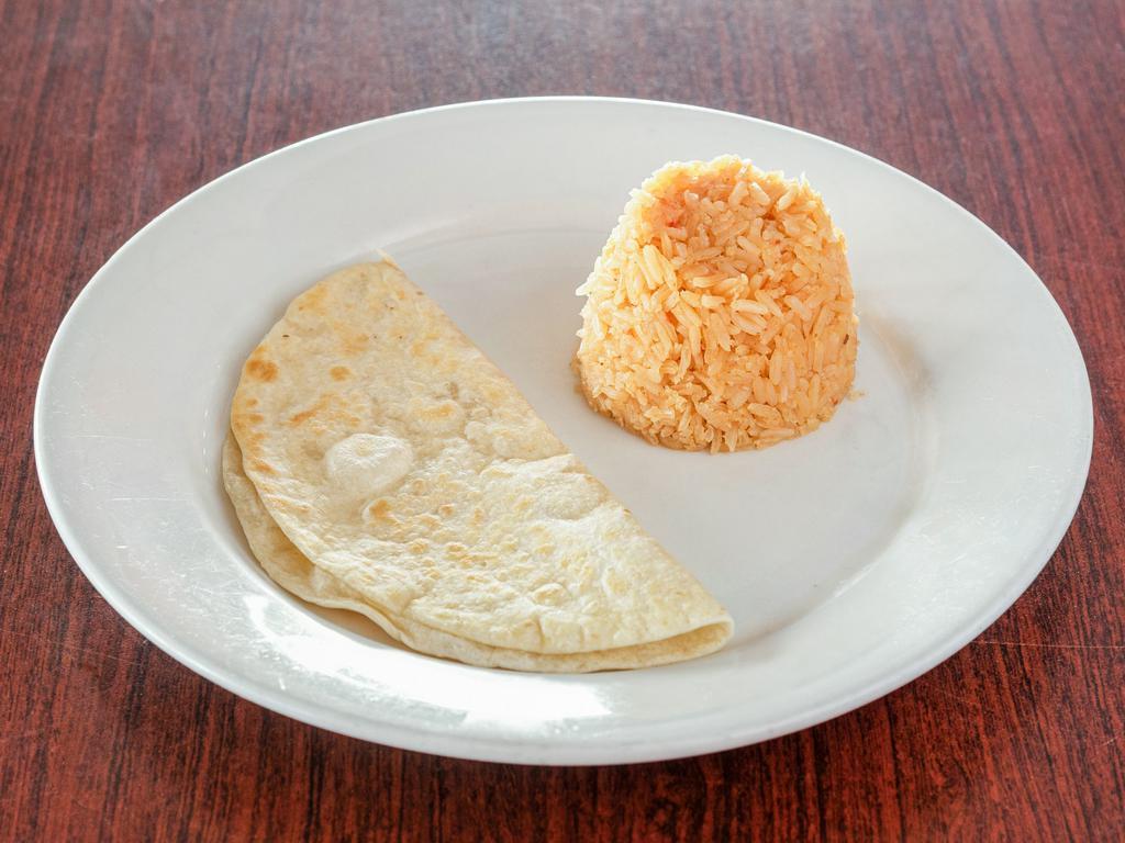 Veracruzana Quesadilla · Wo quesadillas filled with cheese and ground beef, chicken or carnitas. Served with pico de gallo, sour cream and rice.