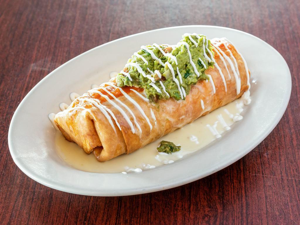 Chimi-Rrito · A big fried chimi-burrito filled with beans, rice with your choice of chicken or ground beef, topped with cheese, red sauce, sour cream and guacamole.