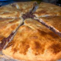 Lobiani Khachapuri · Round baked bread with beans and spices.