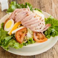 Chef's Salad · Julienne ham, Turkey, Swiss and American cheeses, with tomato slices, boiled egg, on a bed o...