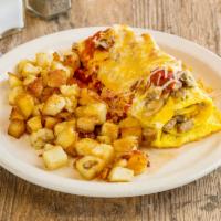 Super Omelette · Ham, sausage, onions, mushrooms and bell peppers, topped with salsa and cheddar cheese.