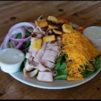 Cobb Salad · Fresh greens, turkey, bacon, cheddar cheese, mushrooms, croutons and choice of dressing.