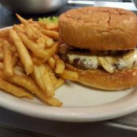 MUSHROOM SWISS BURGER · A 1/4 lb. patty on a toasted bun topped with sauteed mushrooms and Swiss cheese.