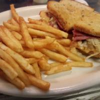 REUBEN SANDWICH · Choice of meat on toasted rye bread with sauerkraut, Swiss cheese and 1000 Island dressing.