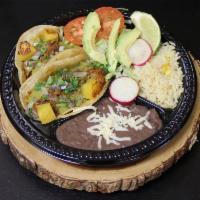 2 Tacos · 2 delicious tacos served traditional style on corn tortillas. Includes onions, cilantro, and...