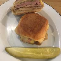 Cubano Sandwich · Comes with roasted pork loin, ham, pickles, mustard, and gruyere.