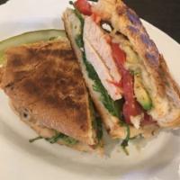 Herb Grilled Chicken Panini · Comes with arugula, tomato, and avocado.