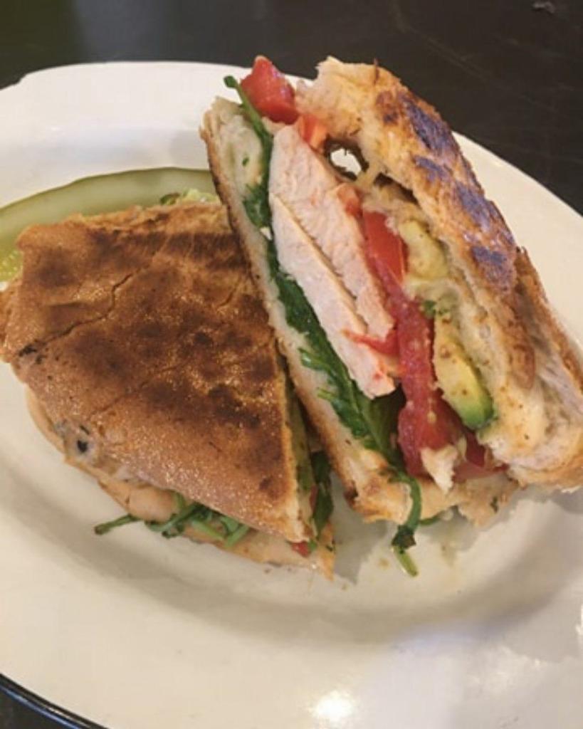 Herb Grilled Chicken Panini · Comes with arugula, tomato, and avocado.