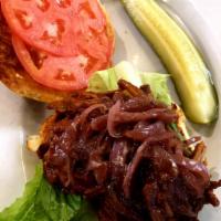 Pulled Pork Sandwich · Comes with caramelized onions on a brioche roll.