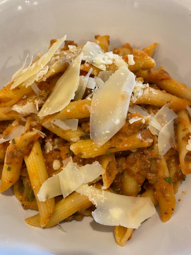 Pasta Bolognese · Comes with shaved Reggiano Parmigiano.