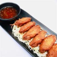 LEMONGRASS FRIED CHICKEN · Gai tod. 7 pcs Bone-in chicken wings marinated in lemongrass, Thai herbs and spices. Served ...