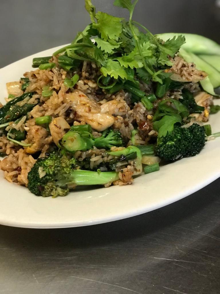 KHAO PAD PHET · Spicy Fried Rice. Wok fried Jasmine rice, eggs, onions, broccoli, and Thai basil in Mama Olay’s spicy sauce.