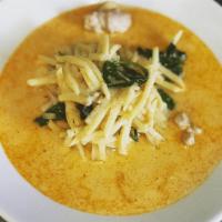 RED CURRY · Gaeng dang. Red curry simmered in coconut milk, bamboo shoots and Thai basil.