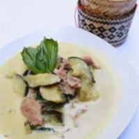 GREEN CURRY · Gaeng kiew wan. Green curry paste simmered in coconut milk eggplant and Thai basil.