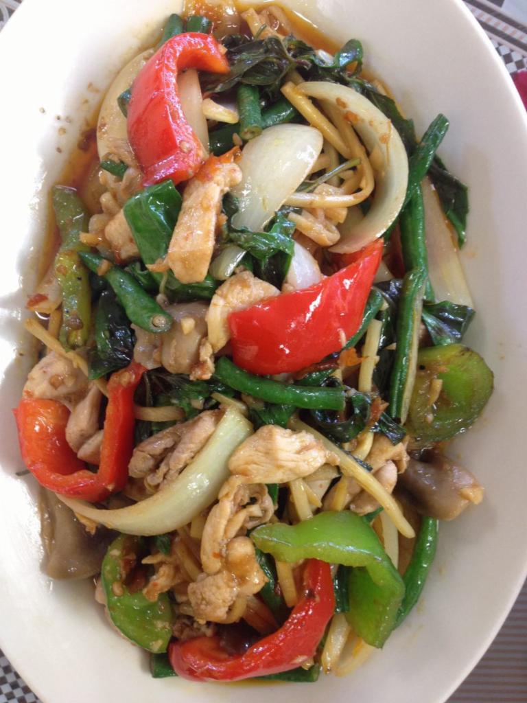 THAI BASIL · PAD PHET:  Mama Olay’s spicy sauce, bamboo shoots, bell peppers, long beans, onions, and Thai basil.
