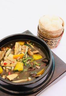 GAENG NOR MAI · Stewed Yanang leaves with bamboo shoots, Kabocha pumpkin, mushrooms, veggies, herbs, and spices. 