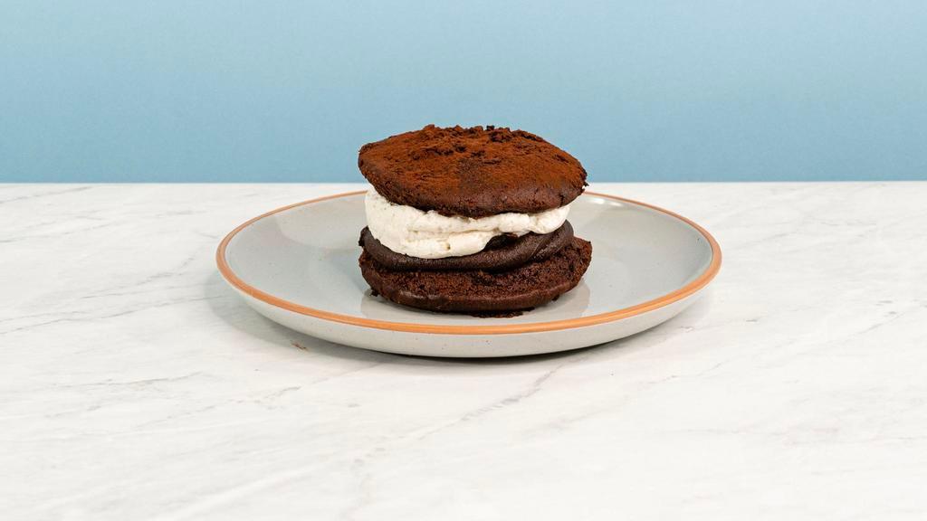 Whoopie Pie · The classic treat and More(ish)!  This devil's food cake sammy is filled with vanilla fior di latte cream and fudge sauce. Large enough to share, delicious enough not to. | Allergen: Milk, Egg