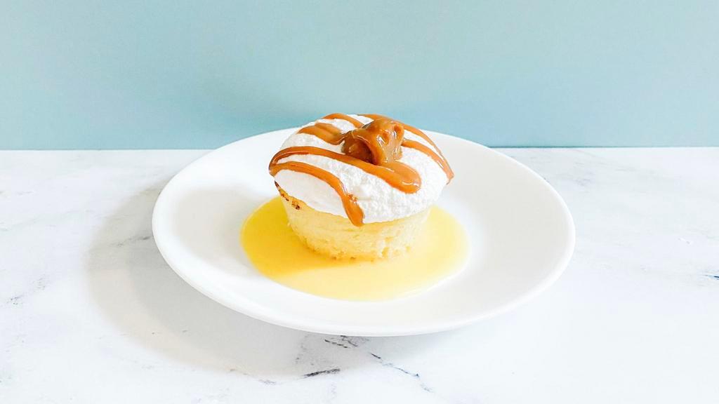Dulce Lemon Cake · This vanilla sponge cake is layered with lemon cream, dulce de leche, and hints of coconut. Rich mallow frosting top our Dulce Lemon Cake. | Allergens: Milk, Egg