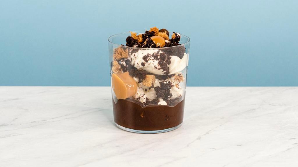 Cookies & Cream Mess · I scream, you scream, we all scream for Cookies & Cream! Whipped creme fraiche mixed with devil's food cake, chocolate chip cookies, and dulce de leche over a base of chocolate fudge. | Allergen: Milk, Egg, Tree Nuts | Nuts