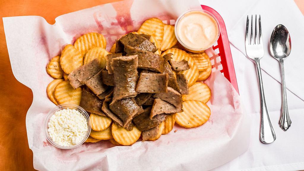 Gyro House Fries with Lamb  · Round cut fries with Gyro meat. Comes with a side of spicy garlic and fetta cheese.