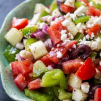 Greek Salad · Feta cheese, lettuce, tomatoes, cucumbers, black olives, red onions, green peppers, and Gree...