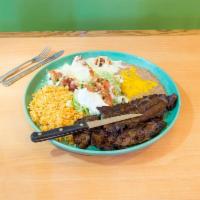 Mi Jalisco · Carne asada along with 5 bacon wrapped shrimp sauteed onions and melted cheese. Served with ...