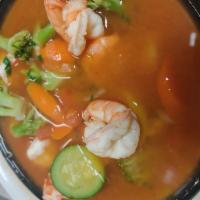 50. Caldo de Camaron · Prawns and vegetable soup with onions and cilantro.