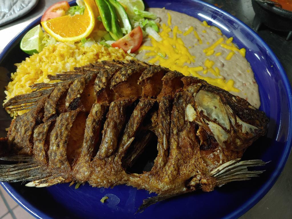 54. Pescado Frito · Whole tilapia fish deep fried. Served with rice, beans and salad.