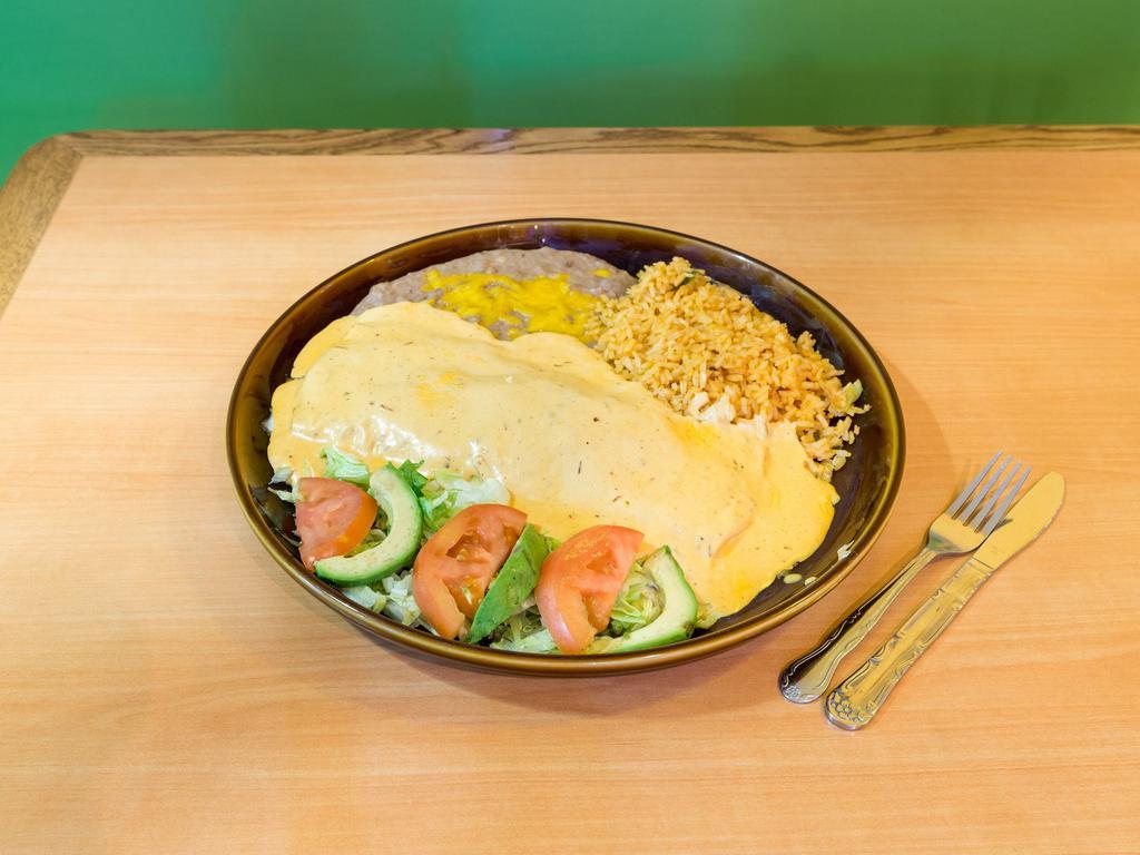 Chipotle Burrito · Slightly hot. Giant flour tortilla filled with grilled chicken sauteed in a creamy chipotle sauce. Served with rice and beans.