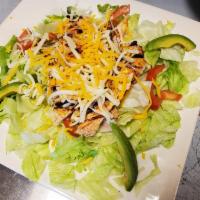 Grilled Chicken Salad · Lettuce, tomatoes, cheesem sliced avocado with grilled chicken breast and cheese.