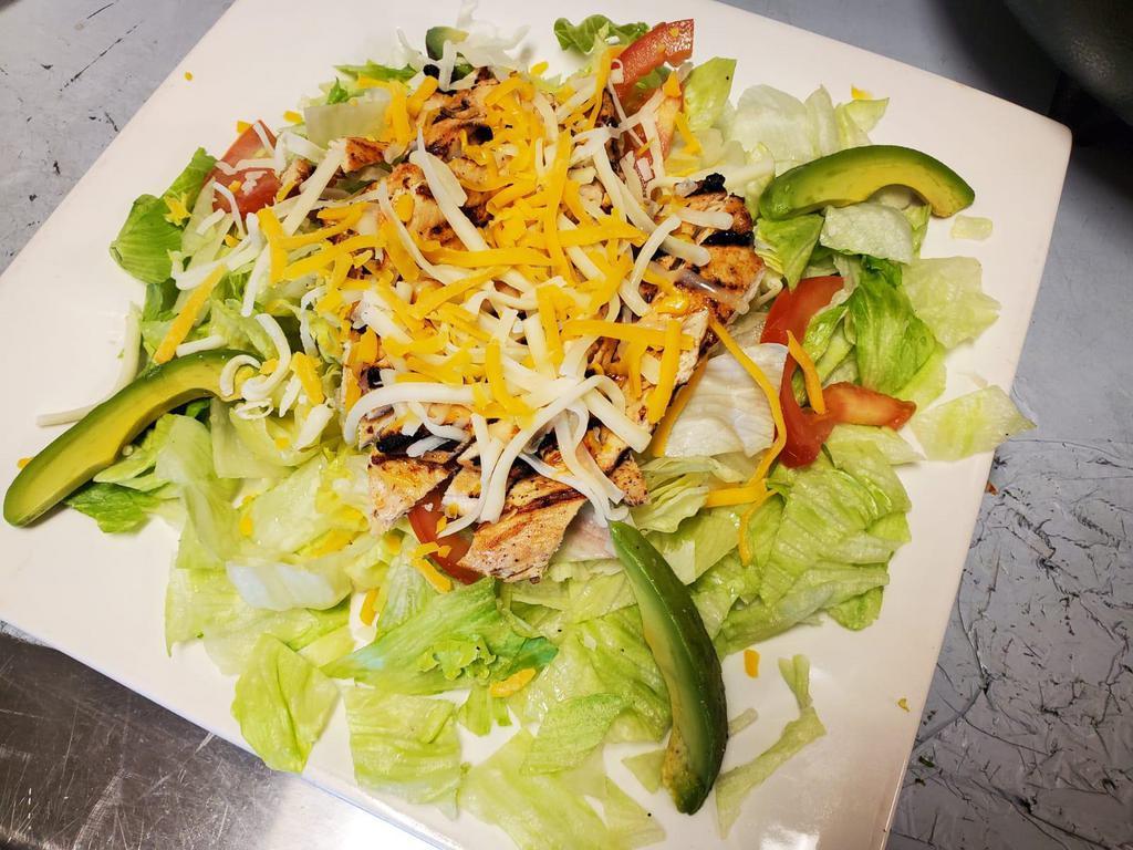 Grilled Chicken Salad · Lettuce, tomatoes, cheesem sliced avocado with grilled chicken breast and cheese.