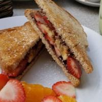 Mighty Nutella · Toasted whole wheat bread, Nutella, sliced banana and strawberries.