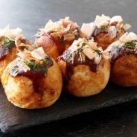 Takoyaki · House-made grilled octopus balls slathered w/ our special sauce, mayo, seaweed flakes & danc...
