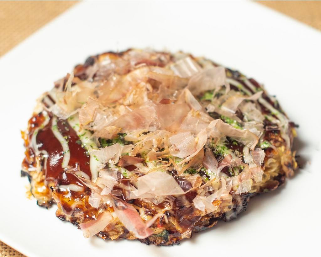 Pork Okonomiyaki · Savory chashu pork pancakes with crunchy cabbage & a variety of fresh ingredients, special sauce, mayo & ‘dancing' bonito flakes for garnish. 