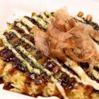Fried Egg & Corn Okonomiyaki · Savory FRIED EGG & CORN pancakes with crunchy cabbage & a variety of fresh ingredients, spec...