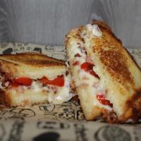 Bacon Love Tomato Grilled Cheese Sandwich · Bread, Bacon, tomatoes, muenster cheese and cheddar cheese.