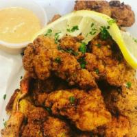 Lobster Nuggets · One Lobster Tail pieced and fried golden, served with our signature remoulade.