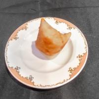 Beef Samosa (1pcs) · One spicy crisp turnover filled with minced beef. Served with tamarind and yogurt chutney.