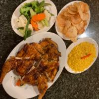 Our Famous Rotisserie  Chicken · Frango no Churrasco. Served with homemade potato chips, rice and vegetables.salad