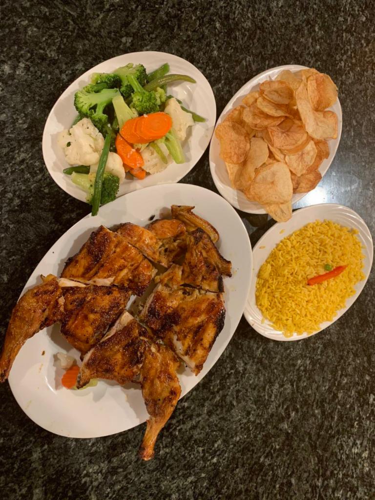 Our Famous Rotisserie  Chicken · Frango no Churrasco. Served with homemade potato chips, rice and vegetables.salad
