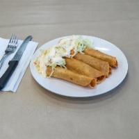 Taquitos Nica · Rolled fried taquitos with chicken, served with cabbage salad  sprinkled with grated  cheese...