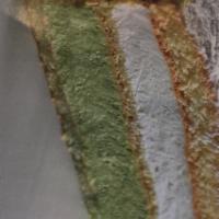 Pistachio cake · Layers of sponge cake, pistachio and ricotta creams, decorated with pistachio pieces dusted ...