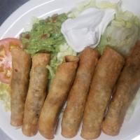 Beef Flautas · Ground beef taquitos served with letuce sour cream and guacamole